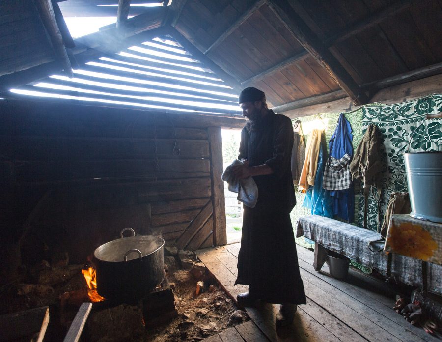 Hermit in the mountains not far from the monastery of Sf. Ioan Iacob Corlățeni making yoghurt.