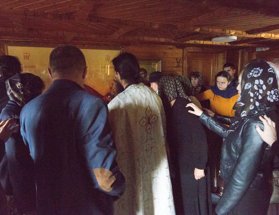 Believers praying in the Romanian Orthodox Sf. Ioan Iacob, Bukovina.
