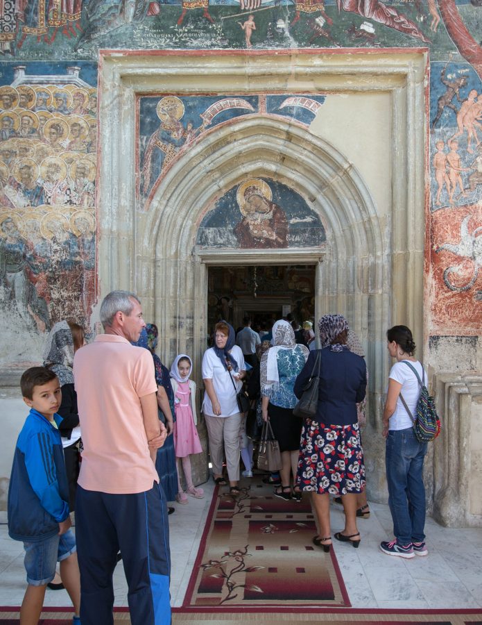 Believers going to church in the Romanian Orthodox convent of Moldovița.