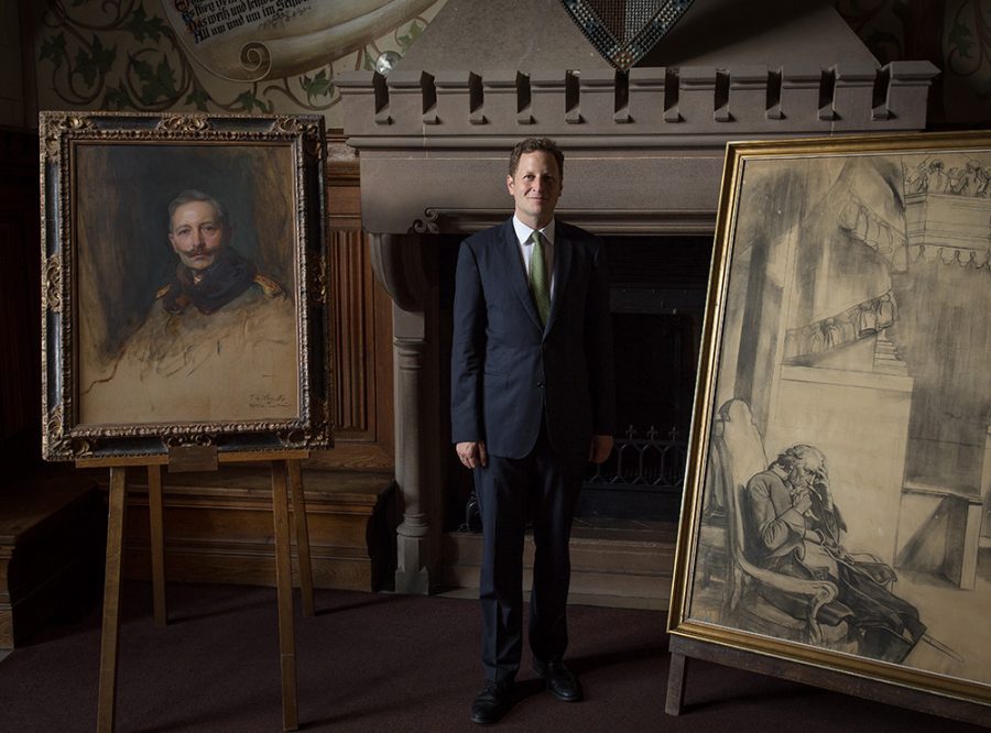 Georg Friedrich Ferdinand Prince of Prussia with portraits of his ancestors.
