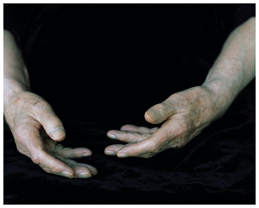 Karl Otto Götz' Hands isolated against deep black background.