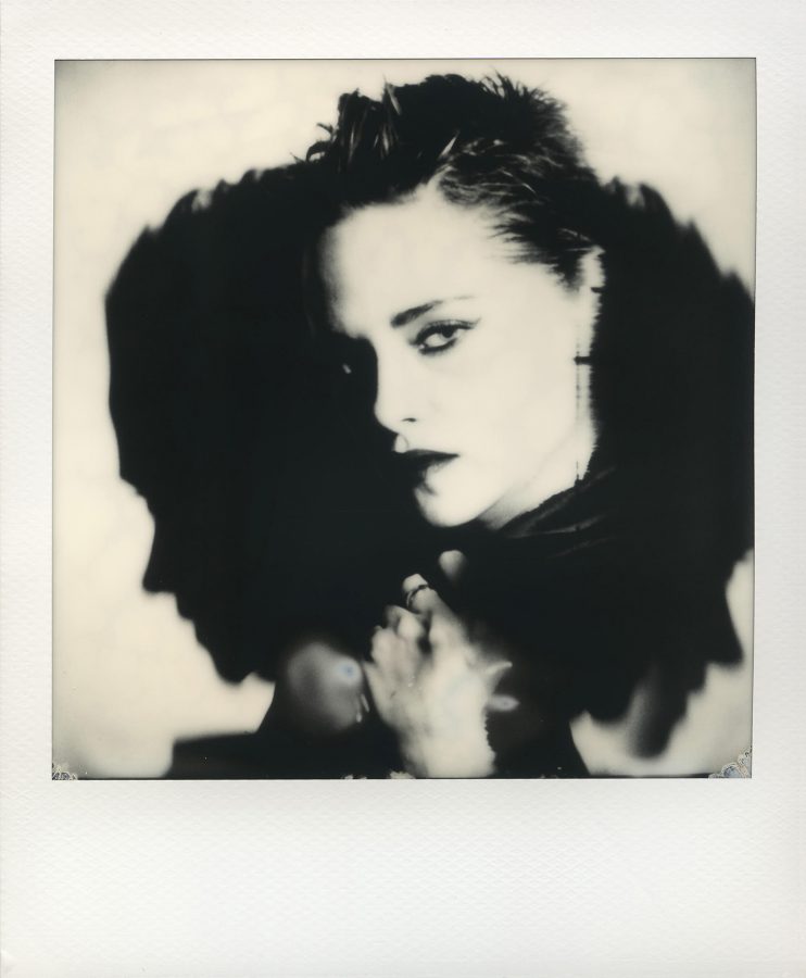 Close-up polaroid of Kristen Stewart casting a shadow.