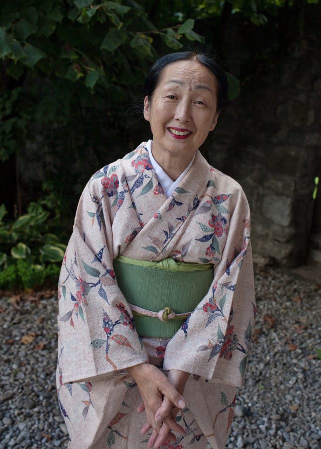 Setsuko Klossowska de Rola wearing kimono in a garden.