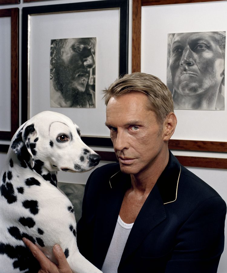 Wolfgang Joop with his Dalmatian in the Villa Wunderkind Potsdam.