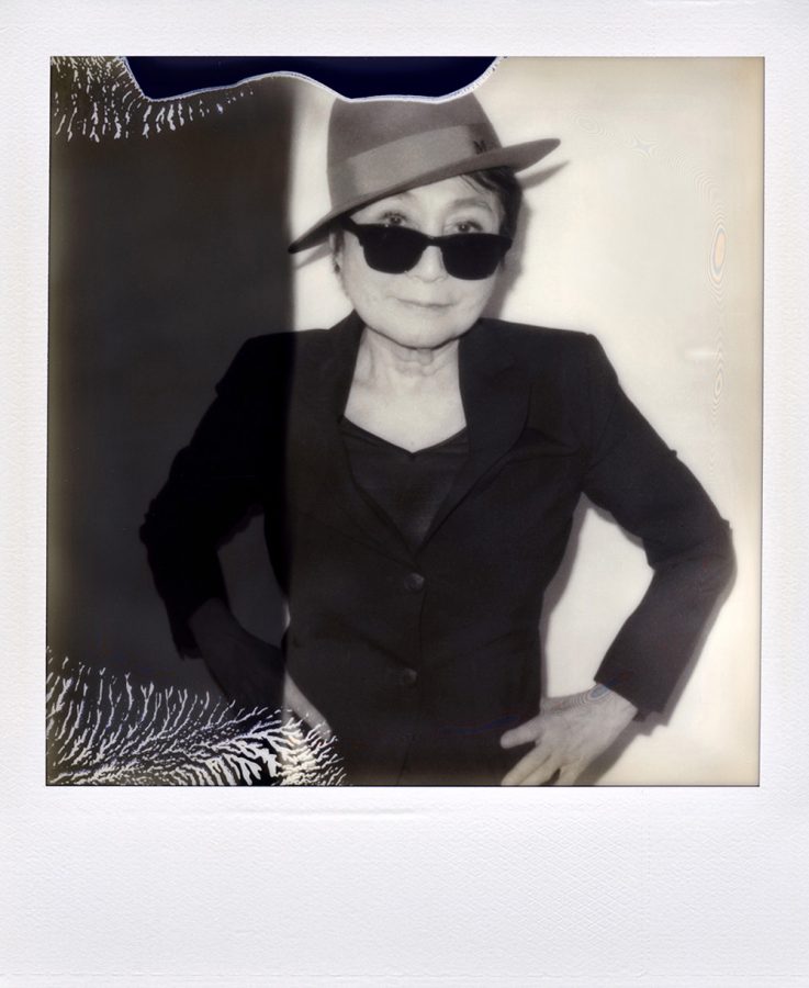 Black and white polaroid picture of Yoko Ono wearing dark glasses.