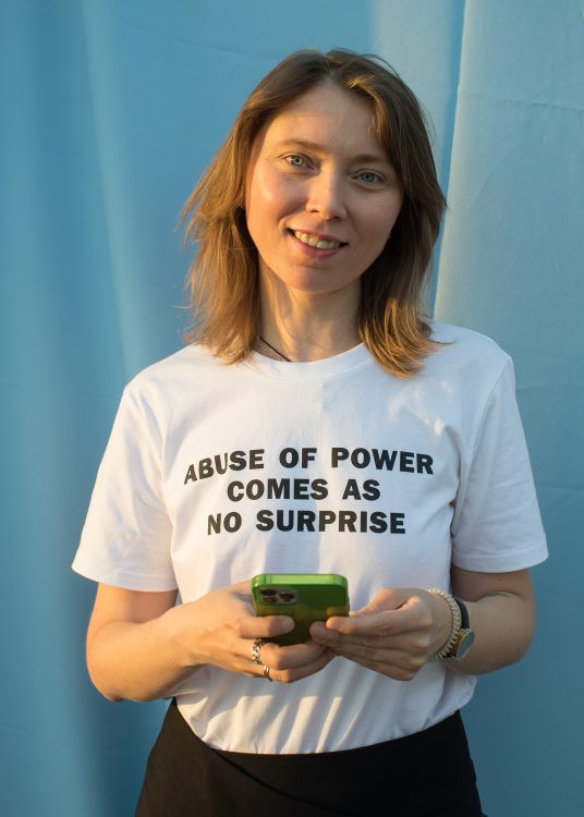 Julia Beliaeva wearing a Jenny Holzer T shirt.