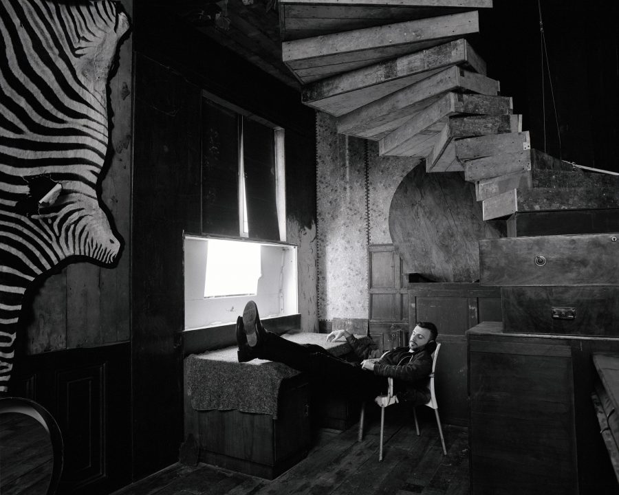 black and white footage of Adrian Ghenie resting in his studio. Berlin 2014