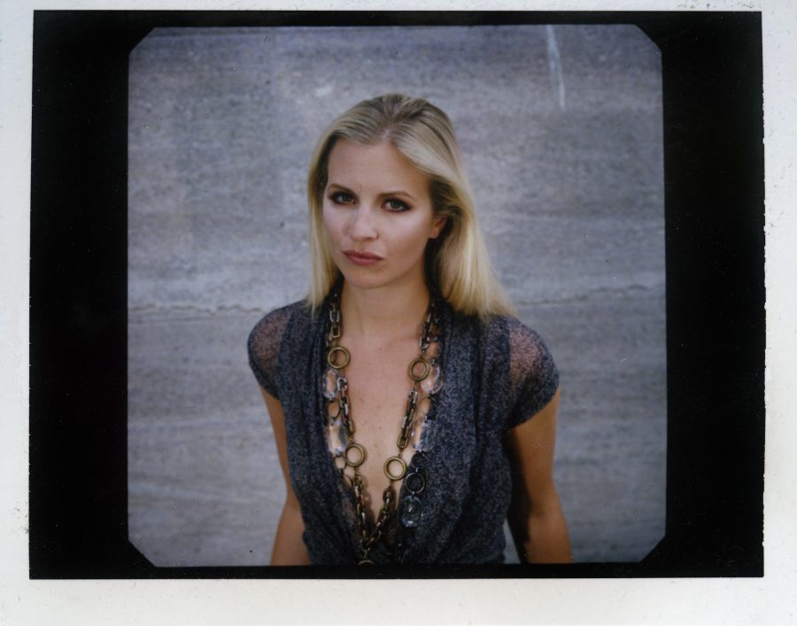 Polaroid photo of trumpet soloist Alison Balsom with golden chain necklace.