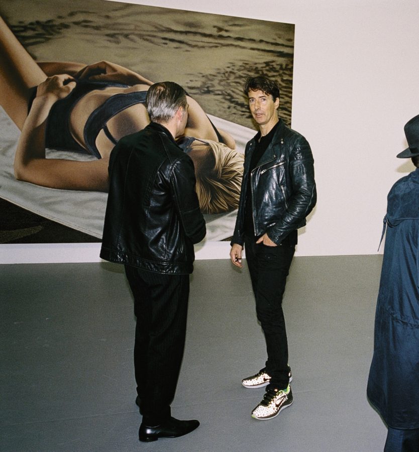 Portrait of the artist Richard Phillips at an opening at the Max Hetzler Gallery.