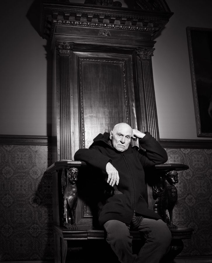Richard Serra seated on an antique throne.