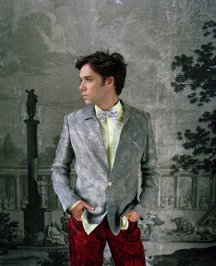 Rufus Wainwright with his hands in trouser pockets.
