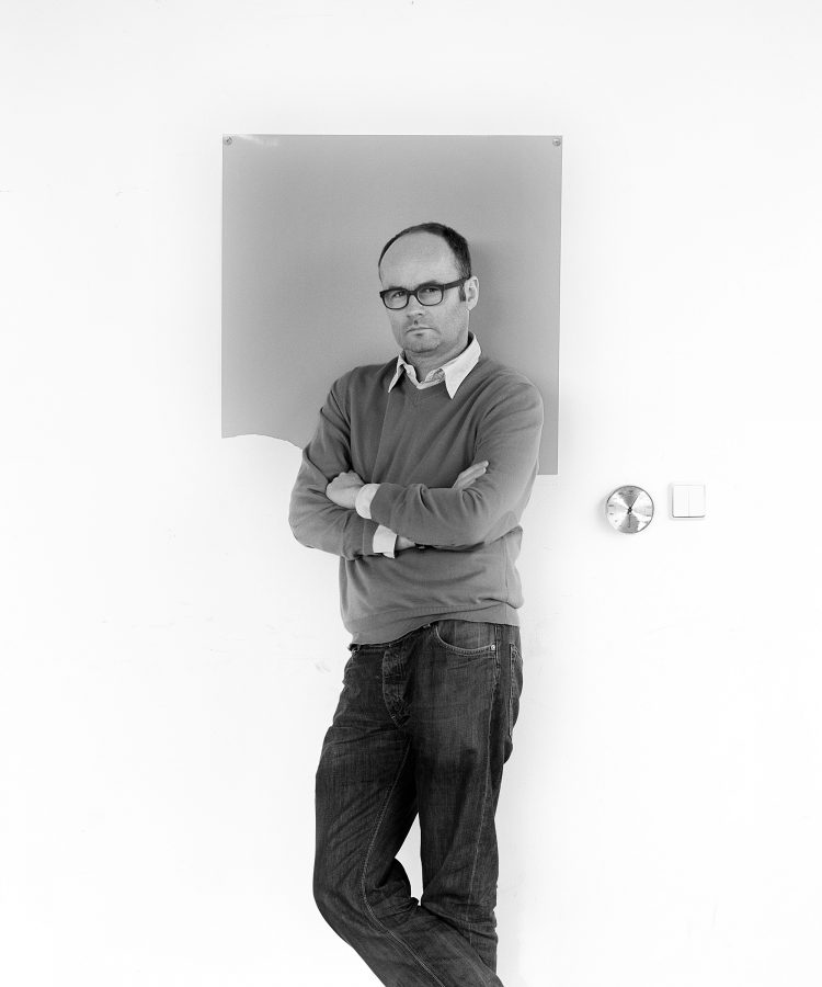black and white portrait of the artist Thomas Demand in his berlin studio.